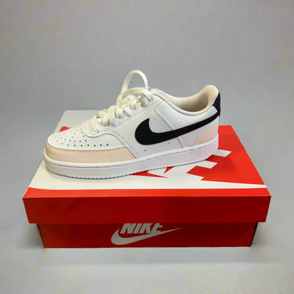 Nike Women’s Court Vision Low sneakers in White/Black-Light Soft Pink, shown in packaging with product label and Nike logo.