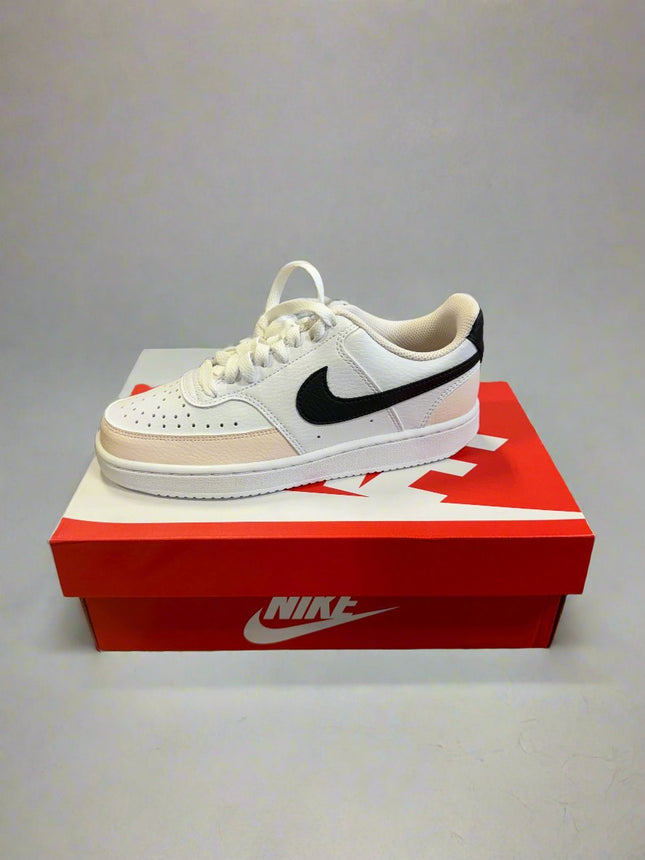 Nike Women’s Court Vision Low sneakers in White/Black-Light Soft Pink, shown in packaging with product label and Nike logo.