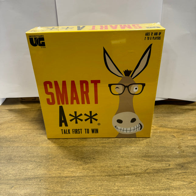 Smart A** Party Game, fast-paced trivia, ages 12 and up, 2-6 players, includes game board, playing pieces, 411 question cards, new condition.