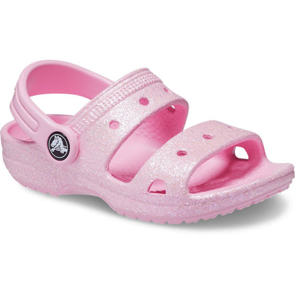 Crocs Classic Glitter Toddler Sandals in pink, featuring a glitter finish and adjustable heel strap. Ideal for stylish, comfortable wear.