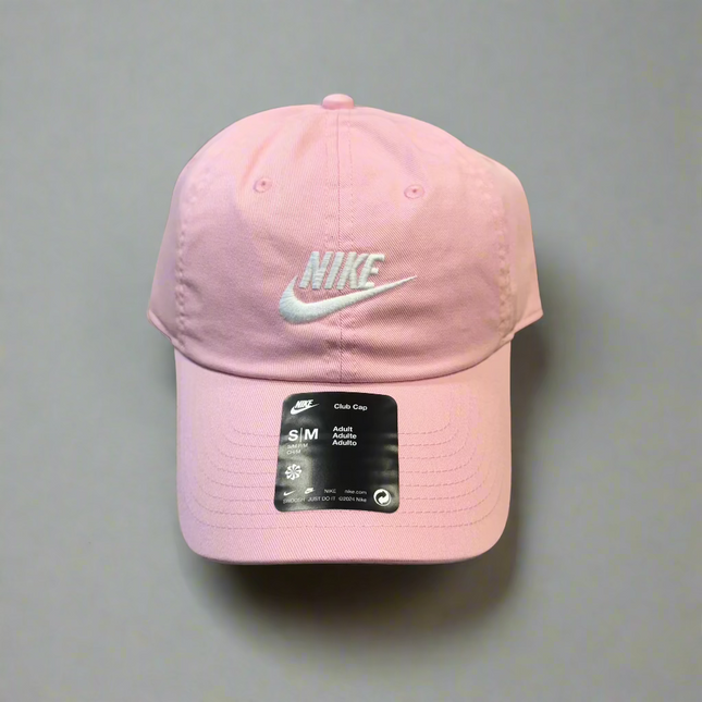 Nike Adult Unisex Cap in pink, size S/M, featuring an adjustable strap for a comfortable fit, perfect for casual and outdoor wear.