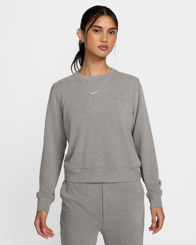 Nike Dri-FIT One Women’s Crew-Neck French Terry Sweatshirt in grey, front view, worn by a model.”