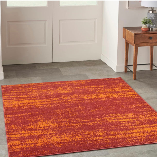 Vibrant red and orange Nourison Essentials area rug, 5’ square, indoor/outdoor use, non-shedding”
