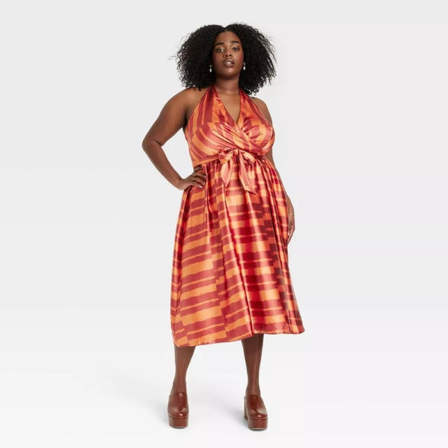 Women’s halter satin dress from the Black History Month collection, new with tags, one size, orange and red stripe pattern.